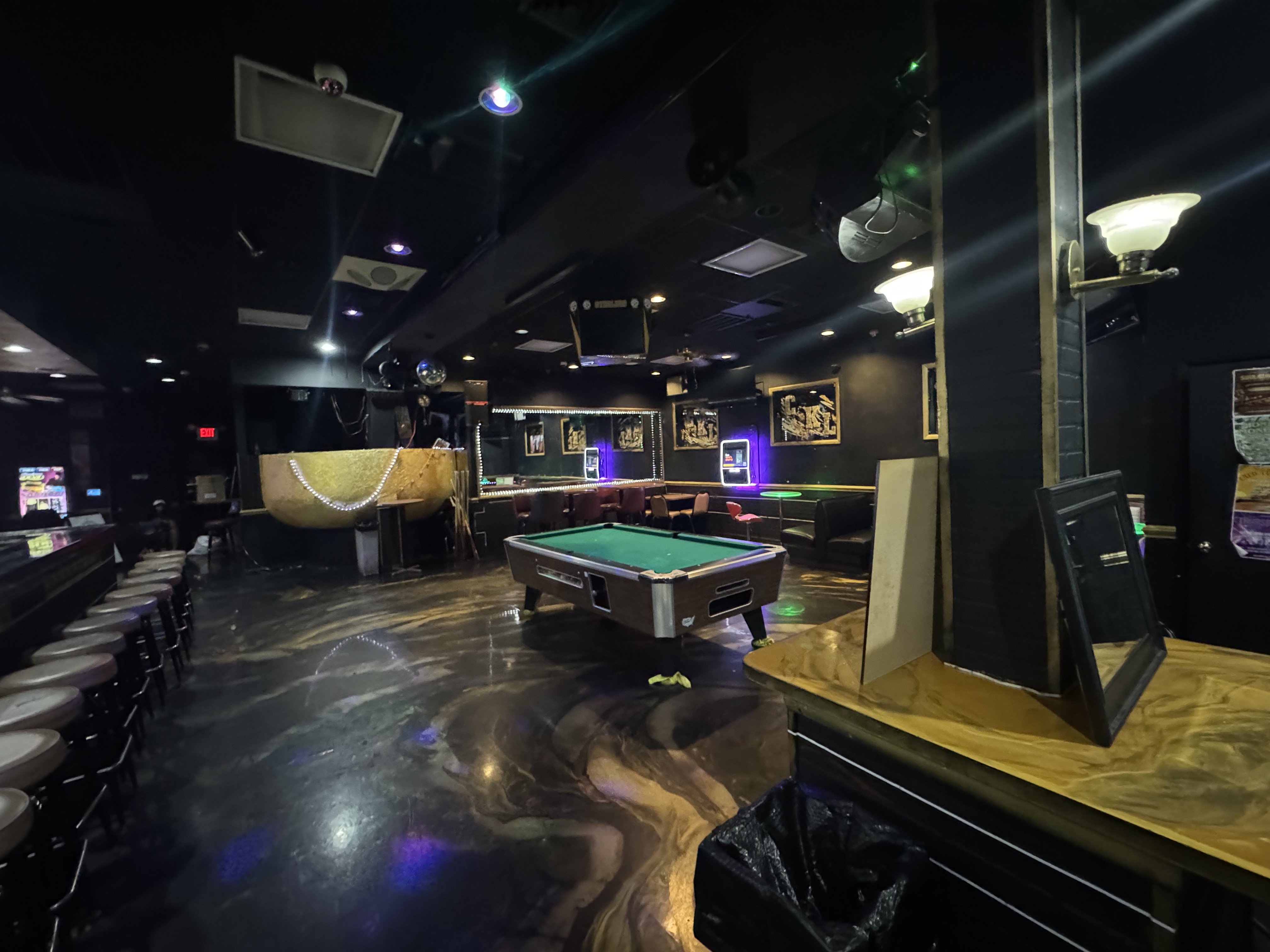 Inside GKL Bar & Grill with pool table and gold bar
