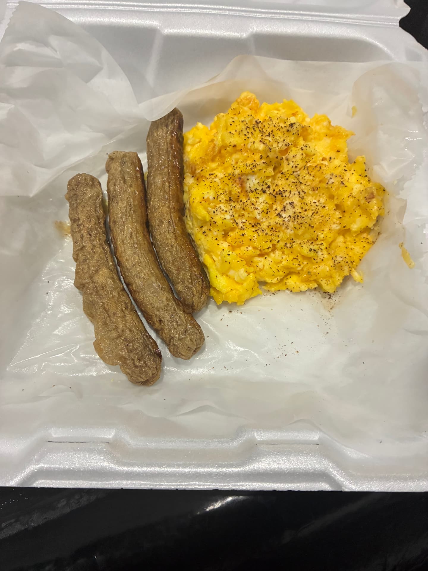 Scrambled eggs with turkey sausage links from GKL Sunday brunch